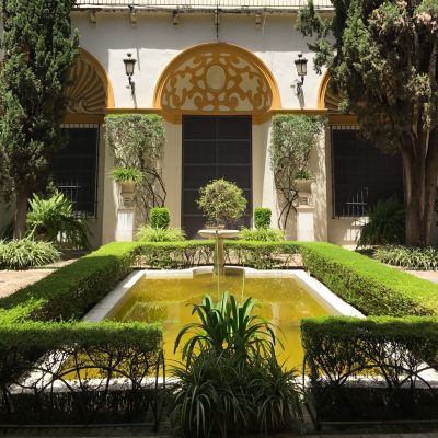 One of Seville's many tranquil courtyards, fountains and plants